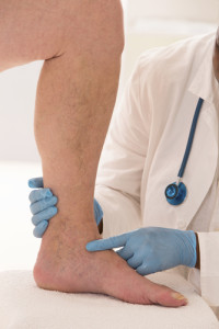 doctor examining a patient's leg